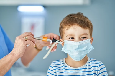 doctor checking ears